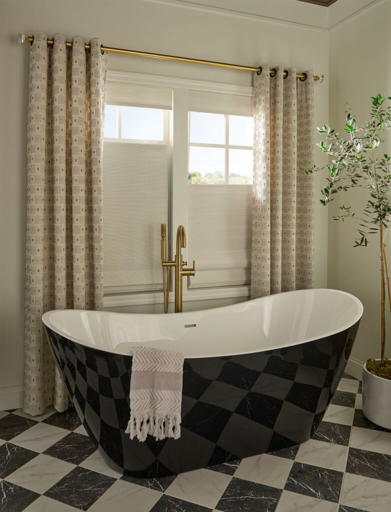 woven wood shades Austin TX bathroom installation with layered drapery and freestanding tub