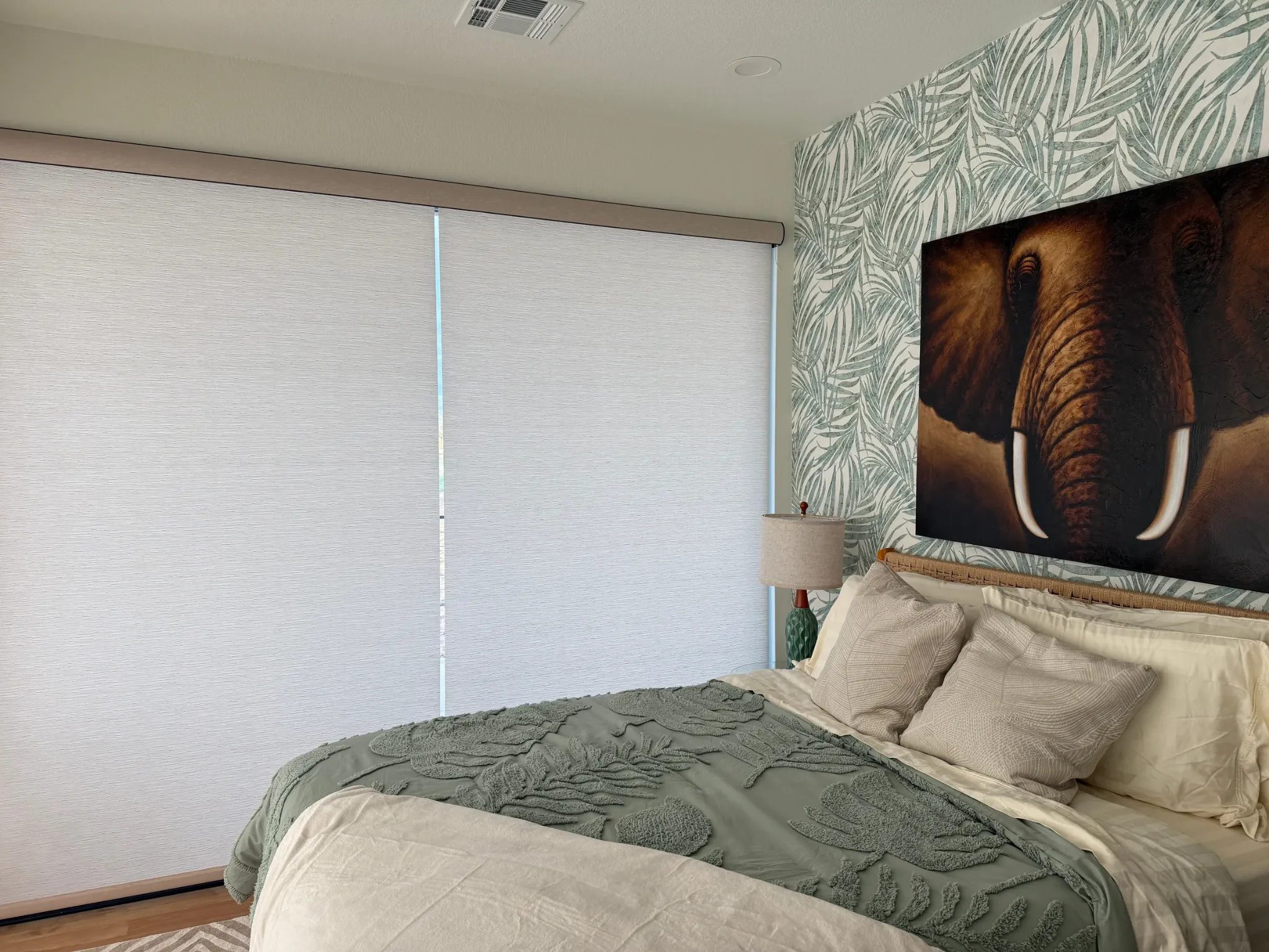 Roller shades installed in bedroom