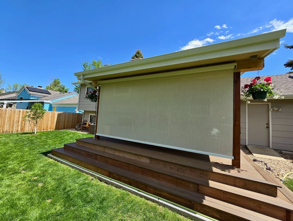 Why are cable-guided outdoor shades the best choice for windy Boulder patios?