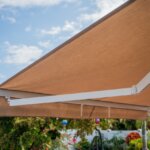 Motorized retractable awning installed on Boulder CO home patio, Front Range outdoor living