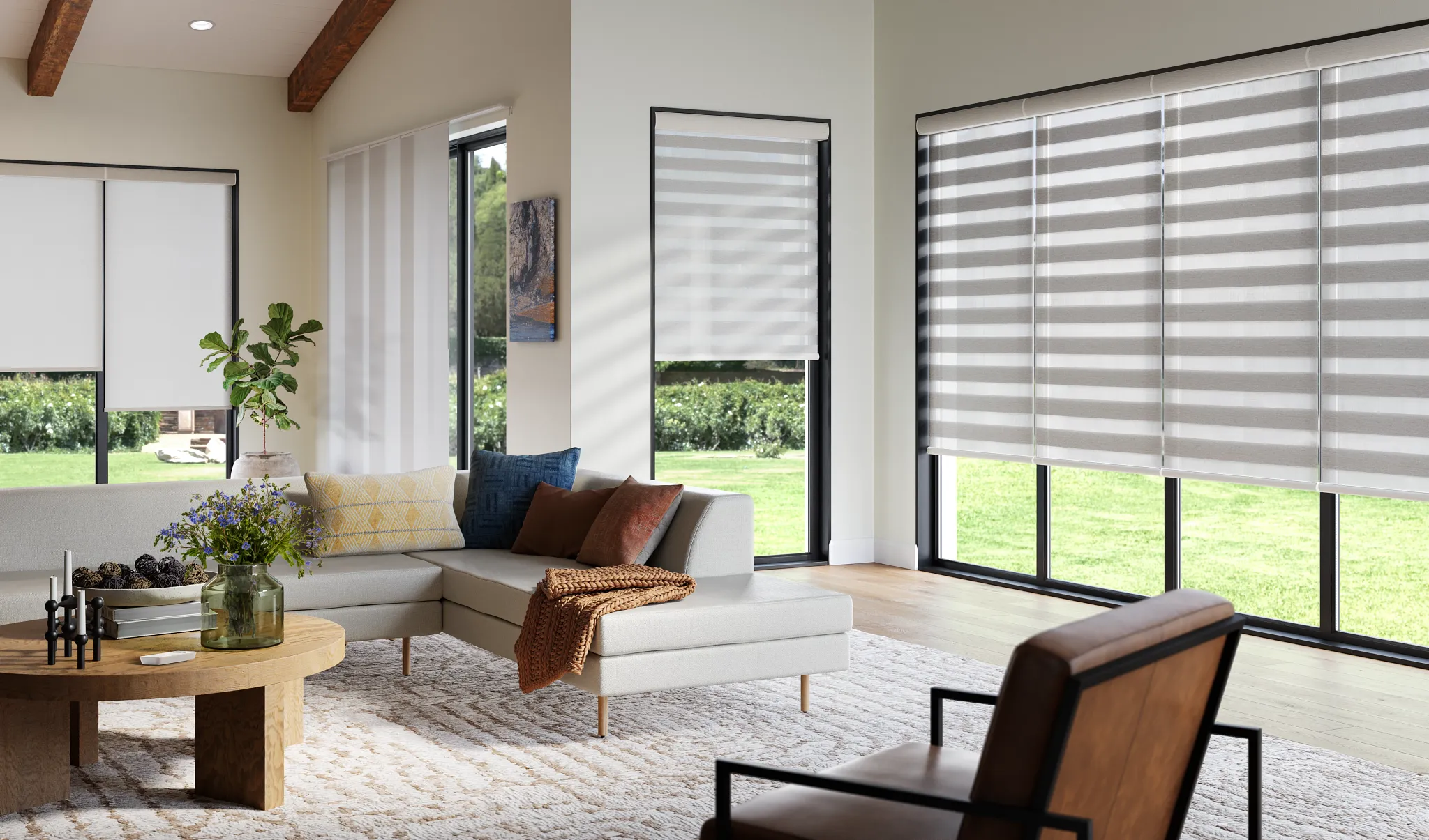 Banded shades, roller shades, and vertical shades shown complimenting each other in open living room
