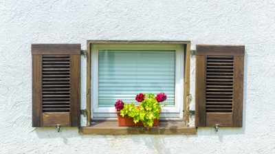 window home basement with wood shutters