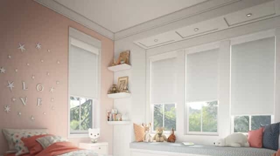 room darkening roller shades in a bedroom