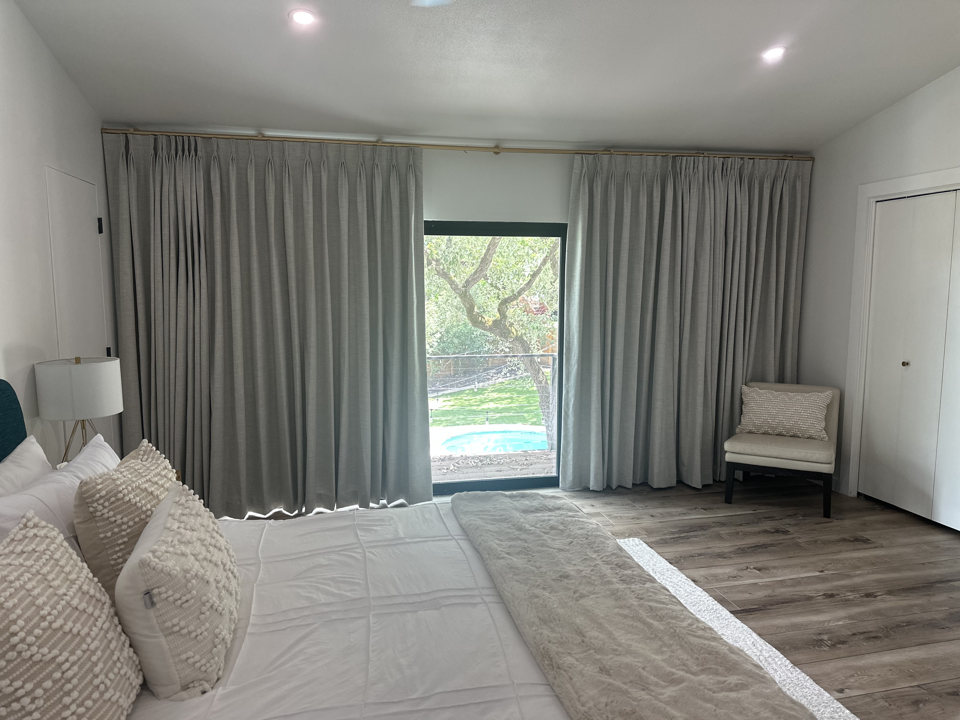 Soft Gray Drapes Elevate This North Austin Bedroom