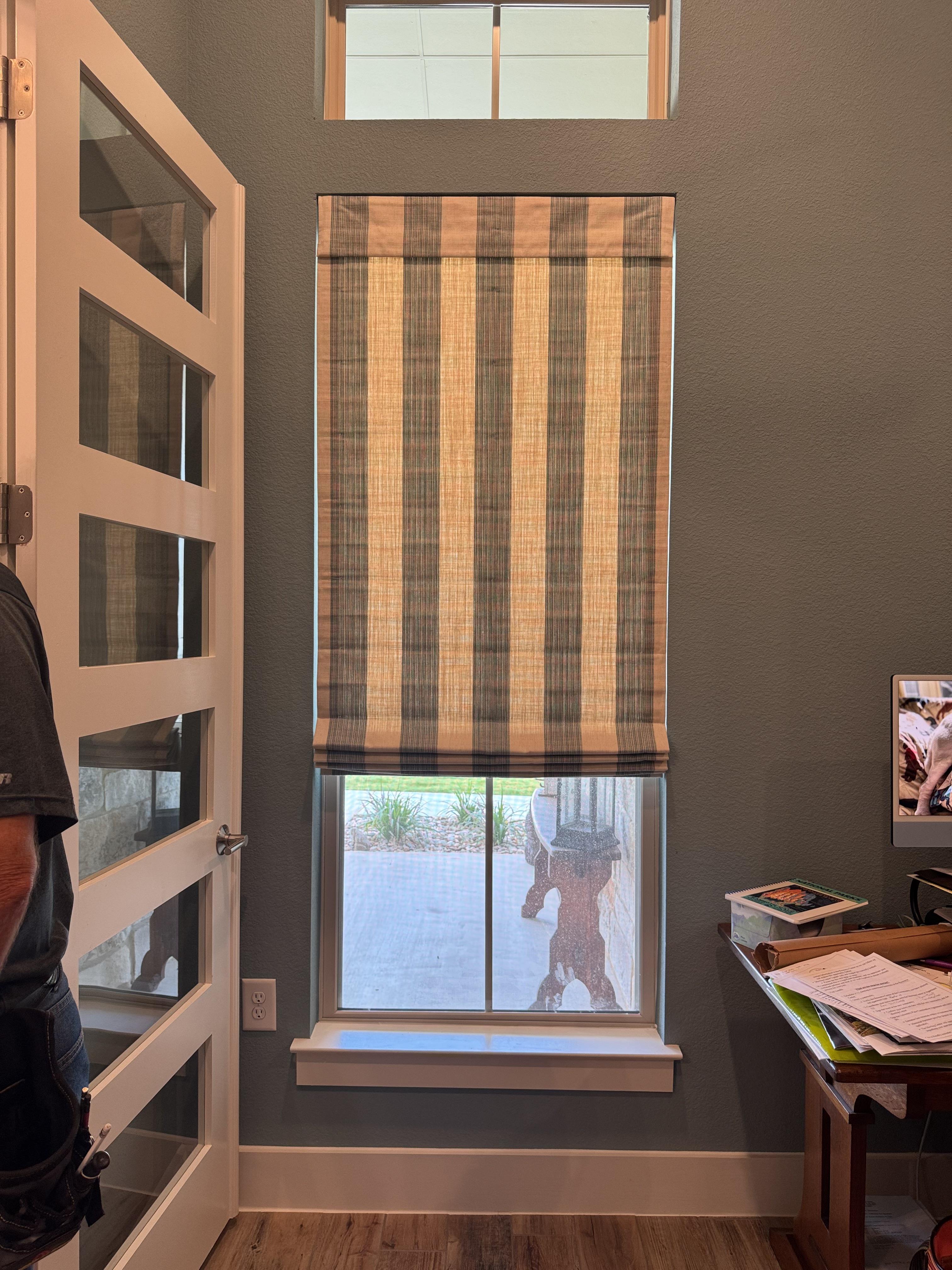 Bold stripes make this Roman shade the star of the entryway.