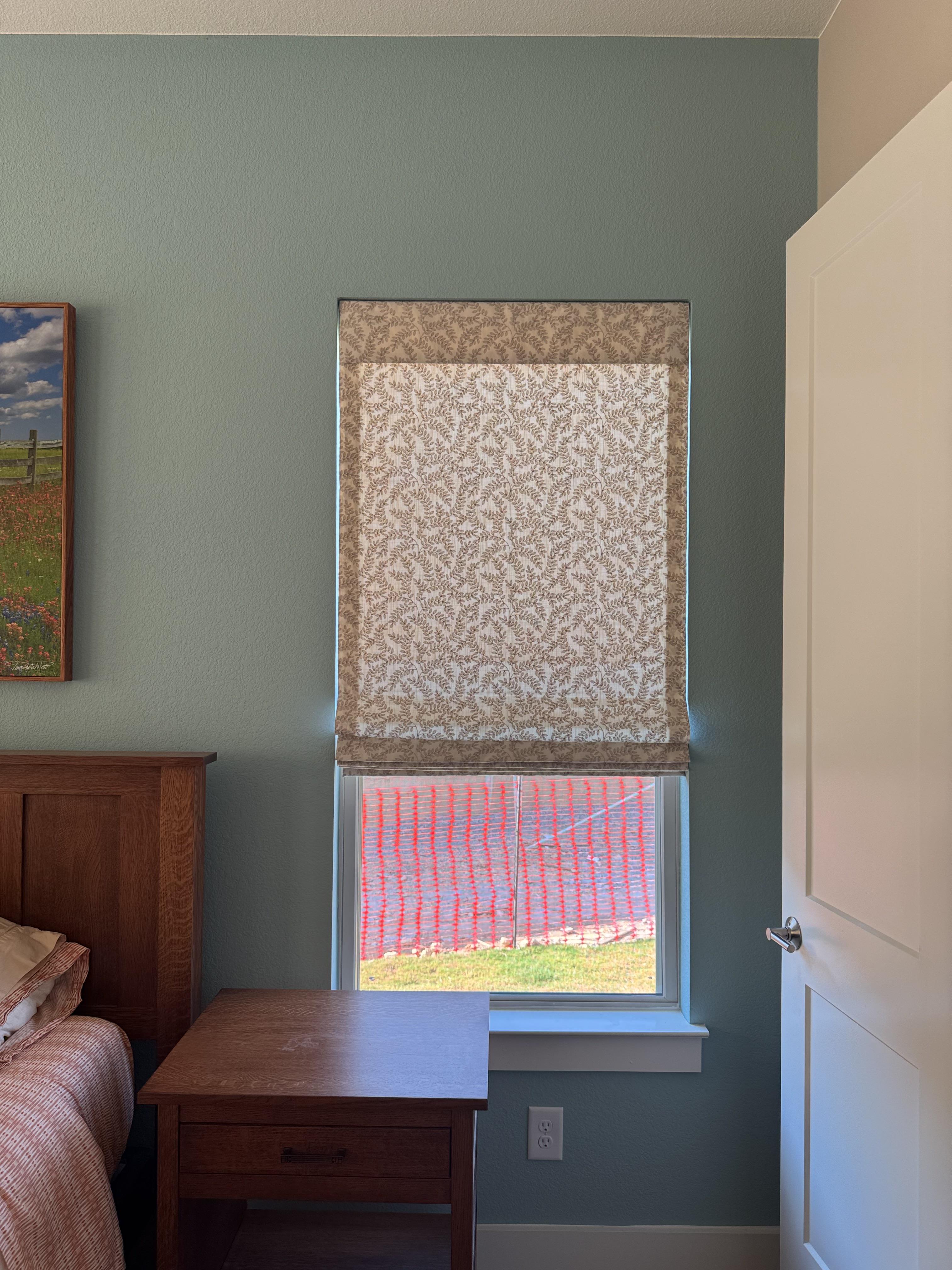 A soft botanical print makes this Roman shade feel fresh and inviting.