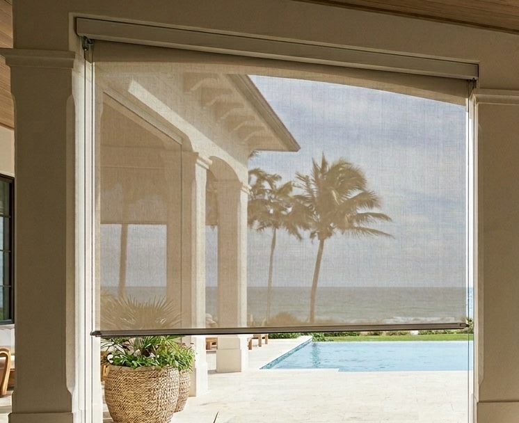 Why are cable-guided outdoor shades the best choice for coastal Palm Beach patios?