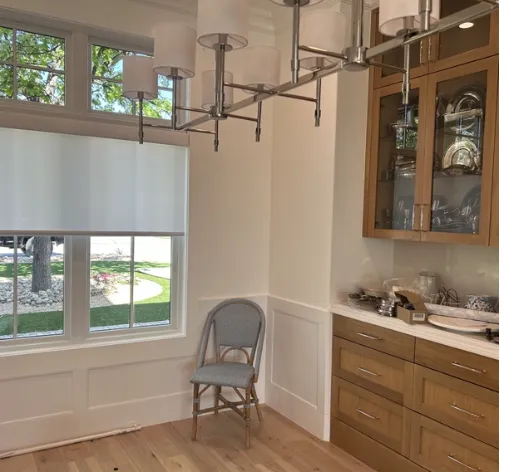 A kitchen with a chair and a windowAI-generated content may be incorrect.