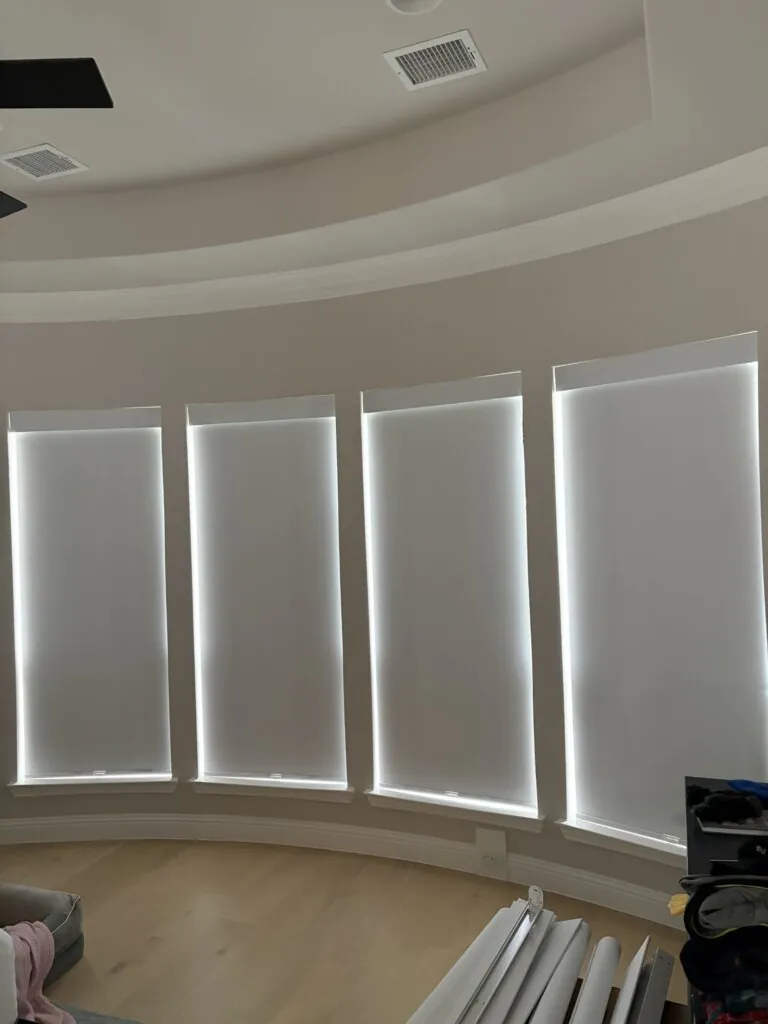 Motorized roller shades installed in a new home in Wylie Texas