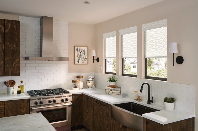 Kitchen showing the widows above the sink have roller shades